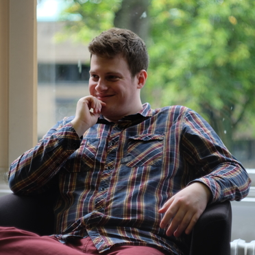 A picture of me stting thinking very hard in the office.