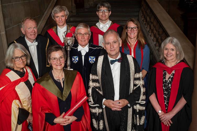 A group of people posing for a photo

Description automatically generated